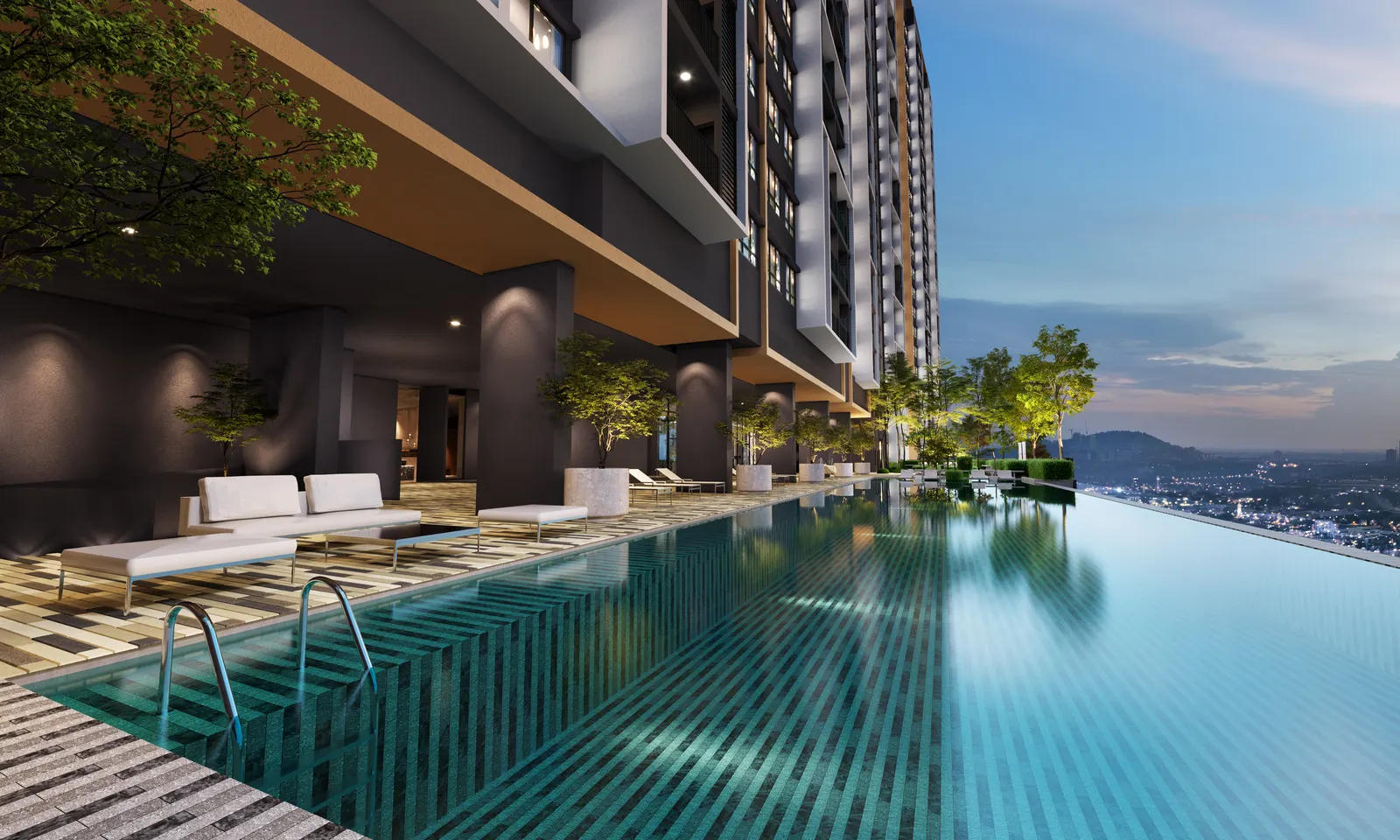 D&rsquo;Evia Residences infinity pool and pool deck at night